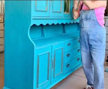 The same hutch painted bright turquoise