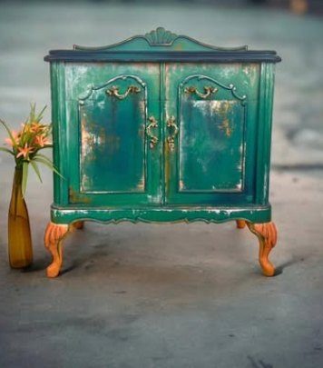 Emerald cabinet on coral legs