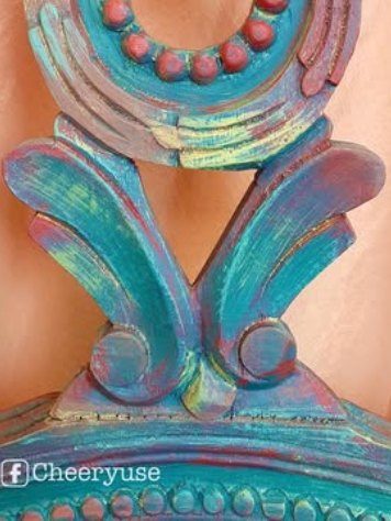 Carved chair back painted turquoise and coral