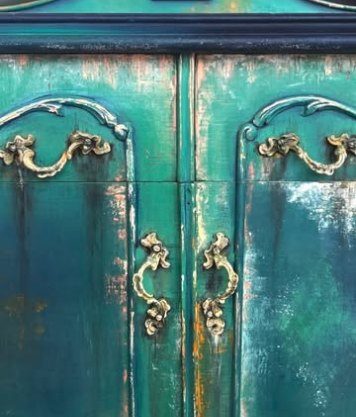 Teal cabinet doors with brass handles